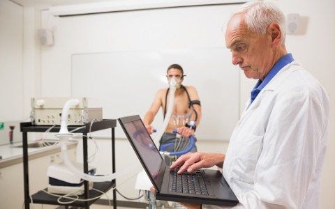 Man doing fitness test on exercise bike at the medical centre